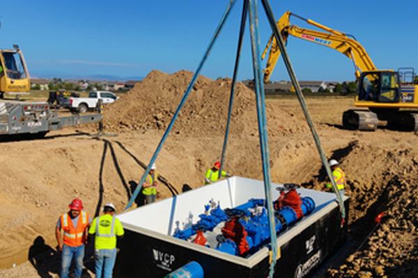 Crew setting a valve vault on the Johnstown water system